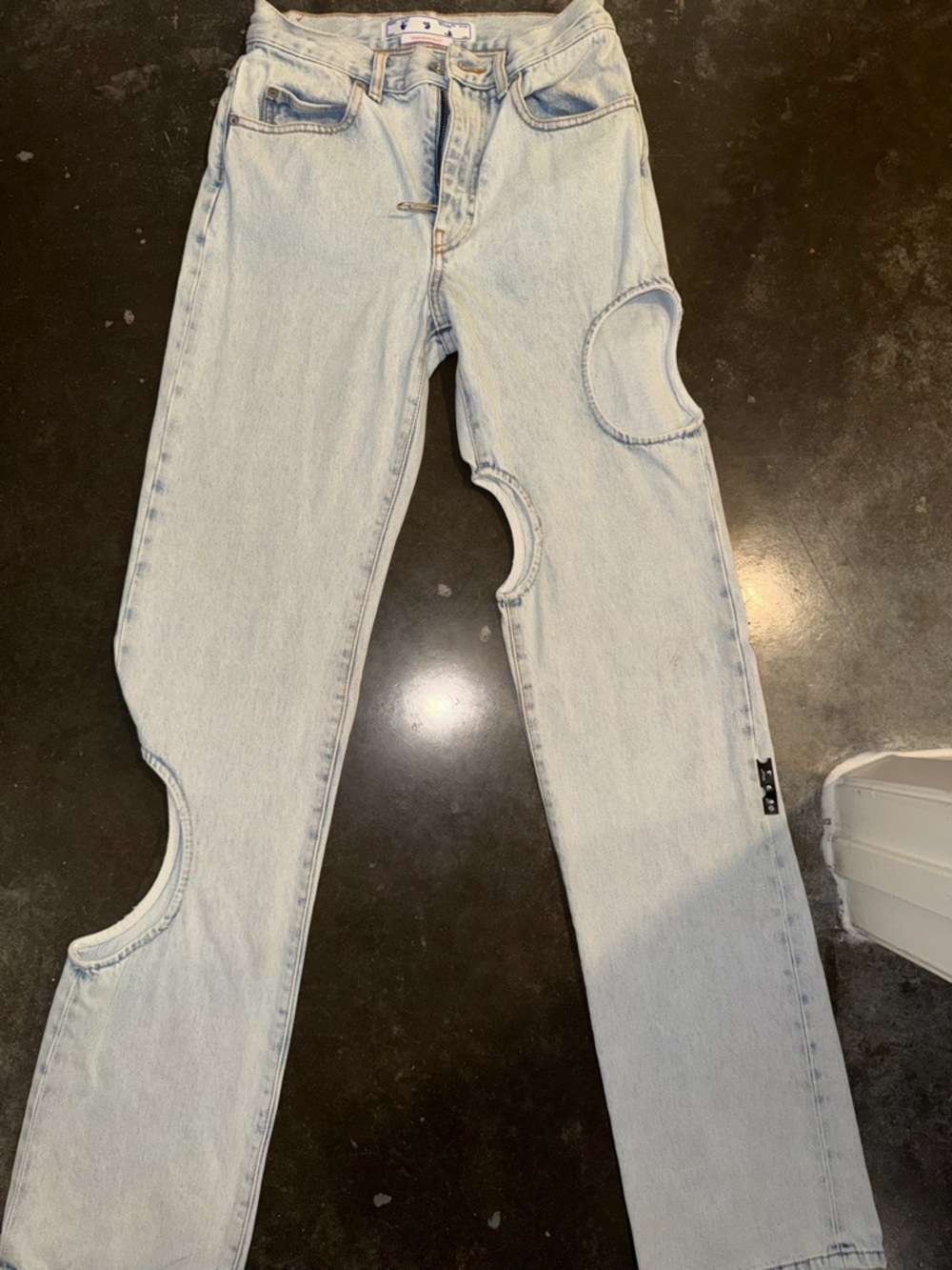 Off-White Light Wash Jeans with Crescent Cutouts